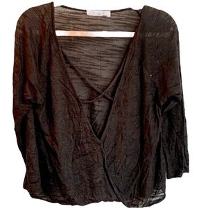 E2 deep v-neck black top with cross cross on neck. Black knit. L